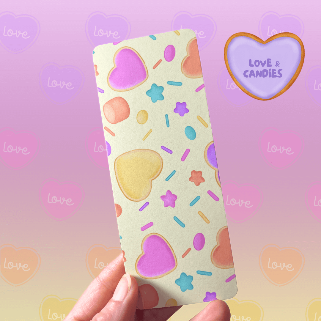 A Bookmark with a heart cookies and marshmallows pattern in a yellow background.